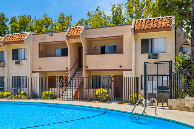 Multifamily apartment complex with pool and terracotta roof in Southern California